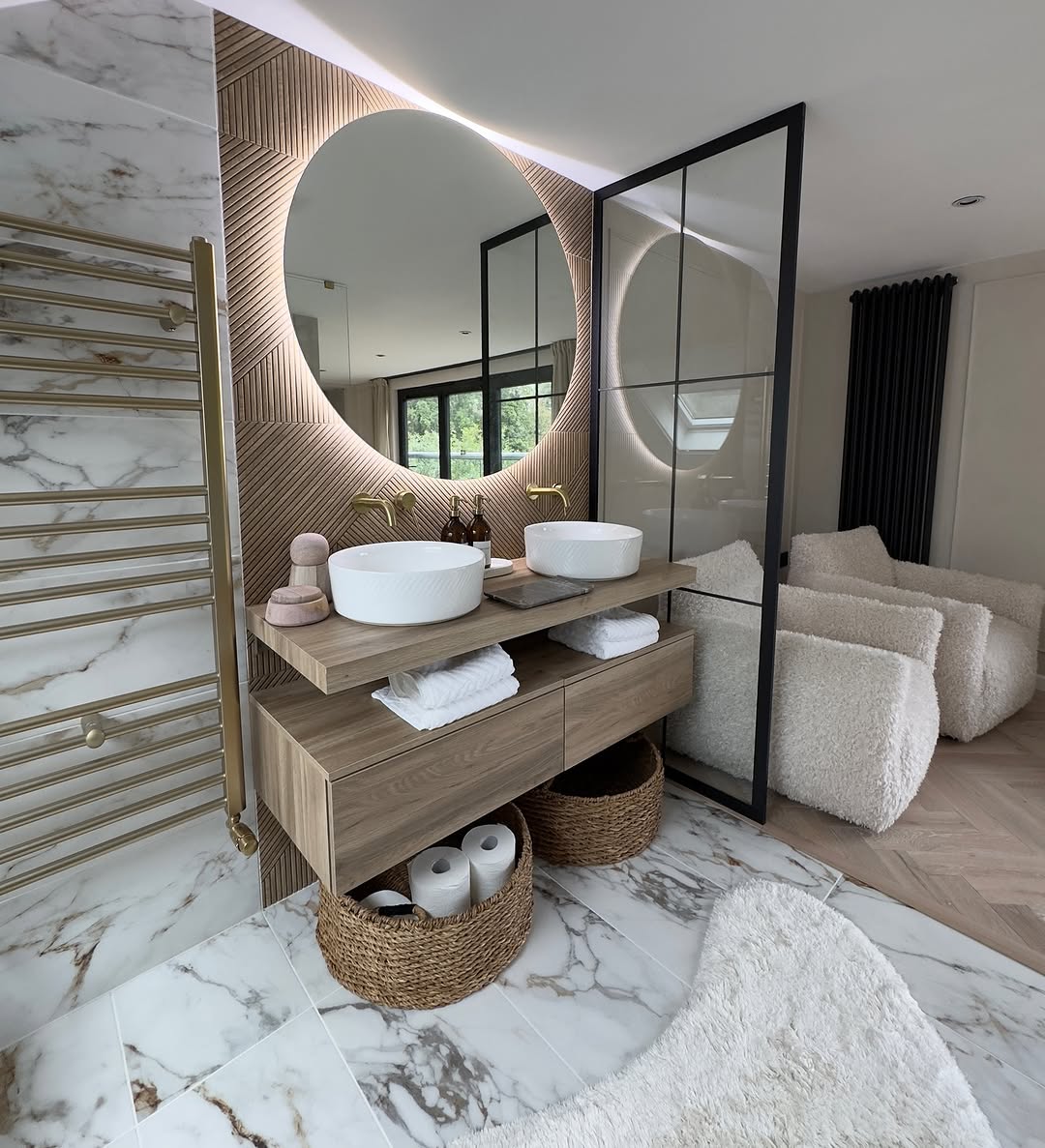 Double basin and a lit round mirror