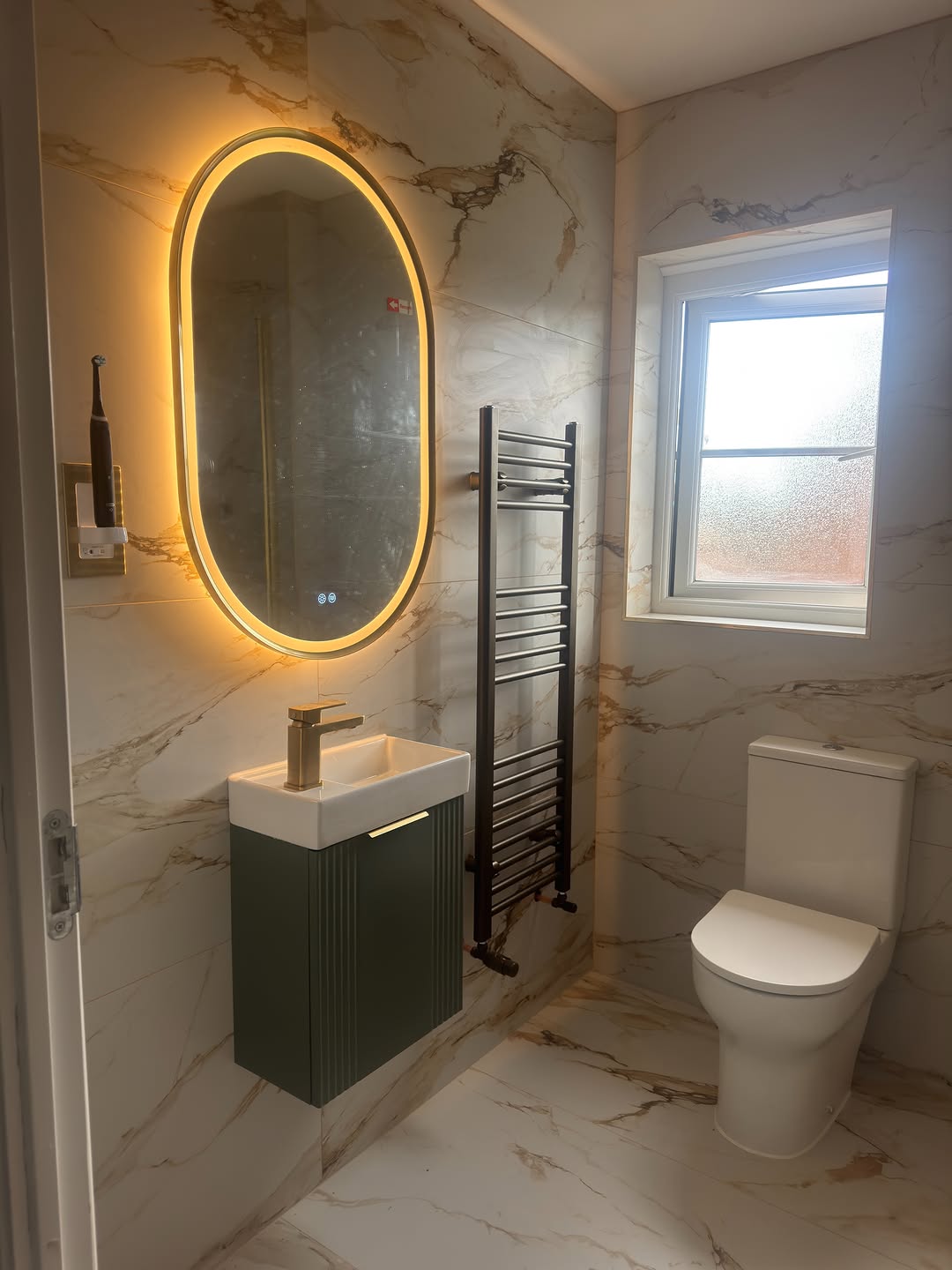 Marble cloakroom with an oval LED mirror